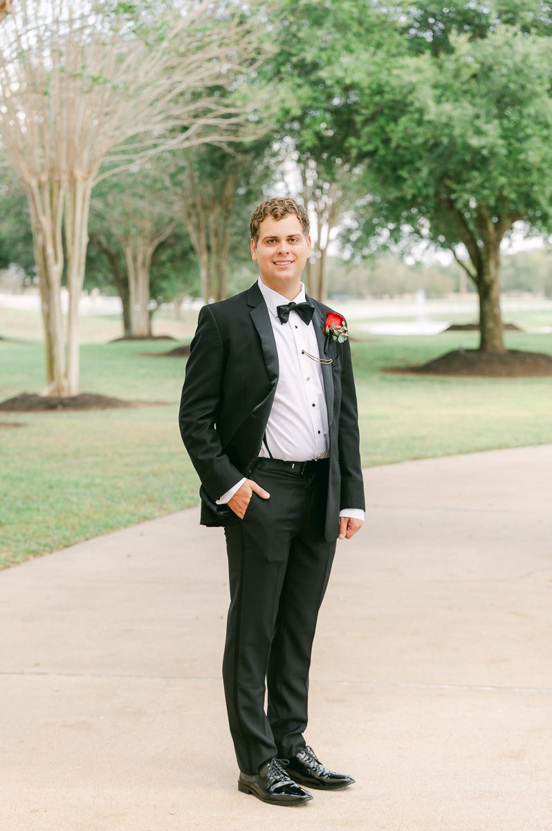 groom in black suit and bow tie in Richmond, Tx