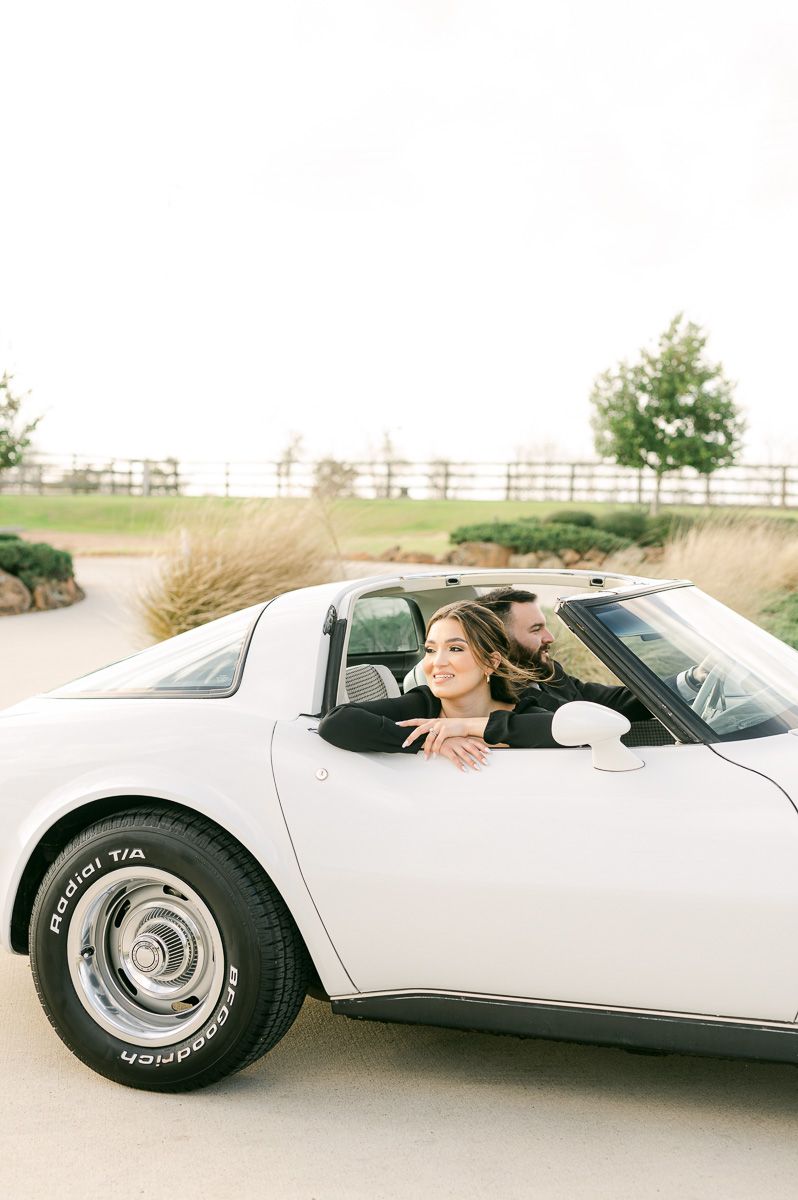 couple at engagement session with vintage car