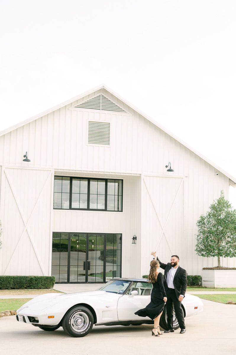 couple at engagement session with vintage car